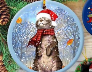 An ornament featuring a cat wearing a Santa hat.