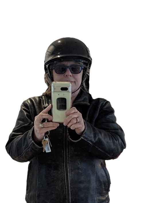 Me doing a selfie into a mirror, with my helmet on and my leather jacket zipped up comfortably.