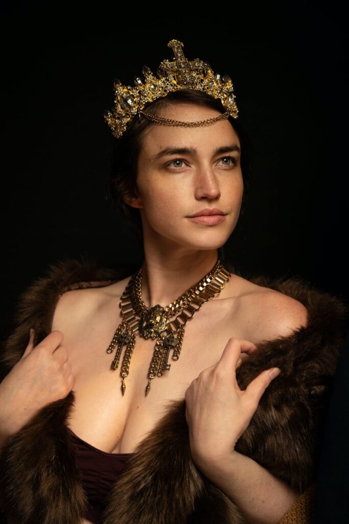 model in medieval gold jewelry and a fox shawl