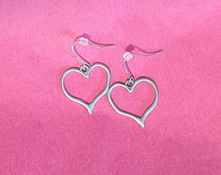 Heart earrings on a pink background