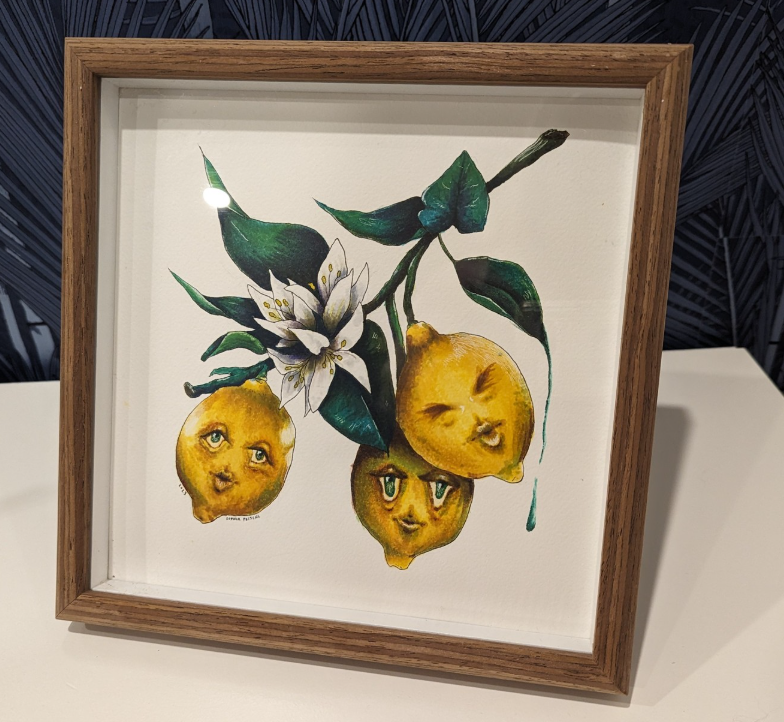  A 12 by 12 original painting of three lemons on a branch. Each lemon has a face and is making a different expression. 